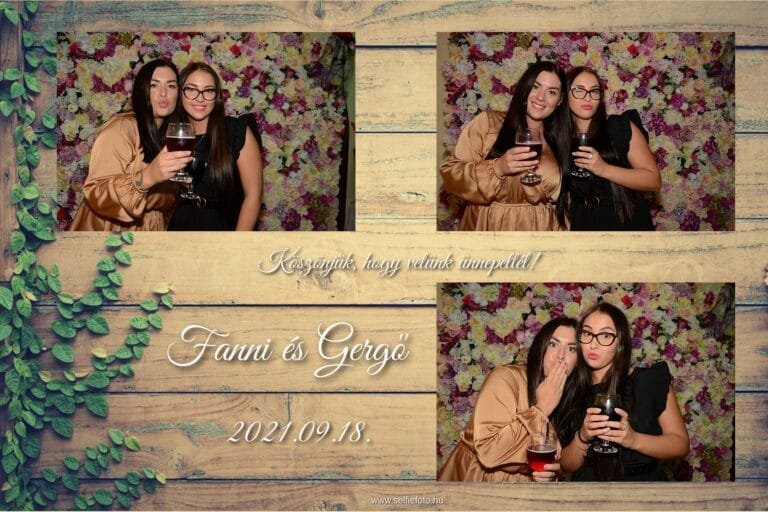 Vidám esküvői selfiebox fotók Fanni és Gergő esküvőjéről. Két hölgy pózol borospohárral egy virágos háttér előtt, nevetve és bohókás arckifejezésekkel. A selfie automata kiváló élményt nyújt esküvői bulikhoz, baráti összejövetelekhez és céges rendezvényekhez, ahol a kreatív és emlékezetes pillanatokat örökíthetik meg.